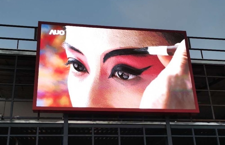 Why can outdoor LED displays with high initial costs be applied across various industries?